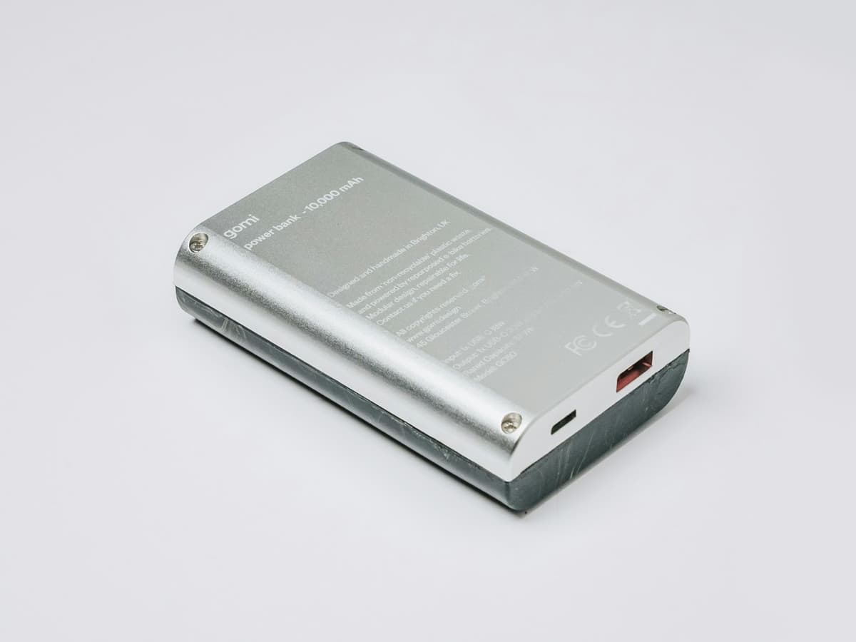 A silver aluminium 10,000mAh power bank on a plain light background